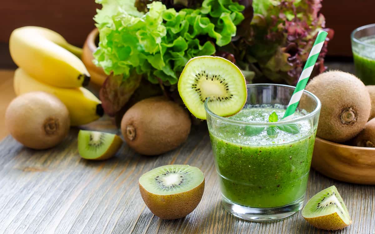 Green smoothie with kiwi, bananas and salad leaves